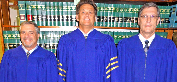 The RMI Supreme Court: Judge Barry Kurran, Chief Justice Daniel Cadra, and Judge Michael Seabright. Photo: Giff Johnson. Landfill areas owned by RMI