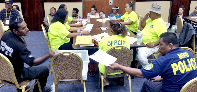 RMI National Election tabulators at the ICC in Majuro count Rairok regular votes Tuesday morning 11-17-15 under the watchful eyes of police and poll watchers. Photo: Giff Johnson RMI Election Update Tuesday AM