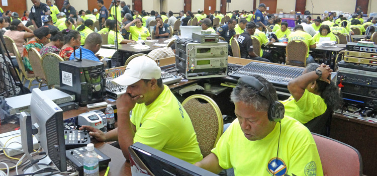 “Voice of the Marshalls” V7AB Station Manager Antari Elbon (right) reviews national election voting results prior to broadcasting results on the radio station Tuesday evening at the ICC tabulation HQ in Majuro. Photo: Hilary Hosia. RMI Election Update Wednesday AM