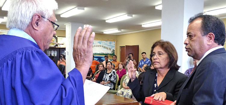 President Hilda Heine sworn in Thursday morning by District Court Judge Milton Zackios. Her husband, First Gentleman Tommy Kijiner Jr. holds the Bible. Photo: Hilary Hosia. Hilda emerges as RMI President