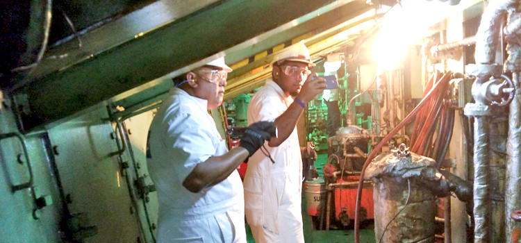 A team inspects the engine room of a ship. Agencies unite for key training