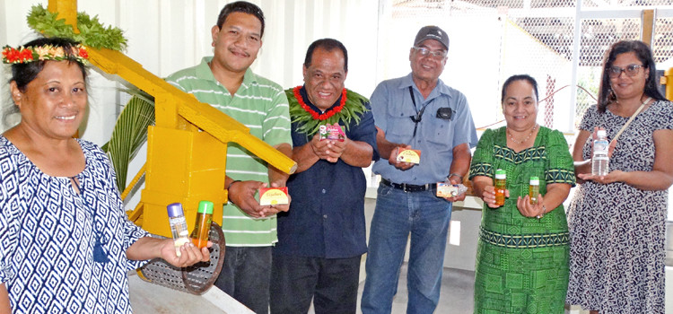 Tobolar representatives show off the many products the plant is producing as a result of its recently completed refinery in the Woja area of Majuro. Photo: Isaac Marty. $600,000 for copra makers