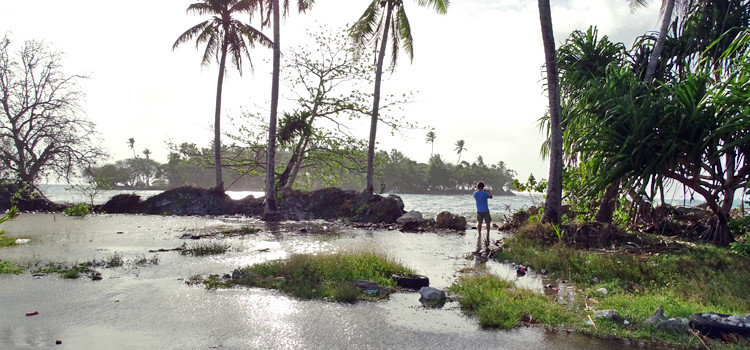 As predicted by US Weather officials on Guam, ocean water began flooding onto Majuro Atoll’s north shore late Wednesday afternoon. In this photo in the Alwal area of Rita, Majuro, Dr. Karl Fellenius of the College of the Marshall Islands can be seen standing at the shoreline taking photos as ocean water floods onto the road. Photo: Hilary Hosia. Guam warns of tidal flooding