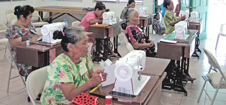 Women on Ailuk try out the new treadmill sewing machines as part of the first stage of a 24-week training program on the northern atoll. Photo: Bonny Taggart. Ailuk project is sew fantastic