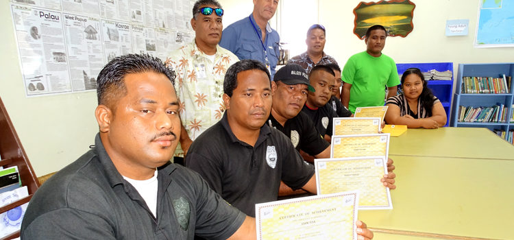 Having recently completing the Basic Computer and Microsoft Application course, officers (from left) Esen Tisa, Maily Tarkio, Leeroy Jitiam, David Reiher and Brandy Tartios held their certificates while (at back from left) Major Ambrose Balos, Alele Museum Director Melvin Majmeto, Sheriff Will Lathrop, and Trainers Tarlos Larron and Angeline deBrum witnessed the ceremony. Photo: Hilary Hosia. MALGov police get IT