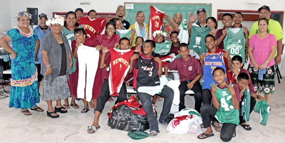 Marshalls Christian High School students and staff join with Majuro Mayor Ladie Jack and MALGov council members to show off some of the donated sports equipment from former NBA Coach Tom Newell, who has visited the RMI several times in recent years. Photo: Hansen Kaisha MALGov helps Rongrong school