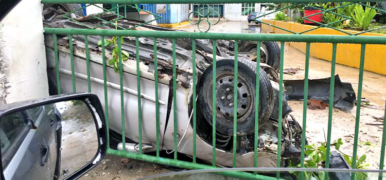 The mangled car after it flipped over and landed in the driveway and security house of the Pan Pacific Foods fish plant in Delap early Sunday morning. Photo: William Ring. Weekend accidents in Majuro