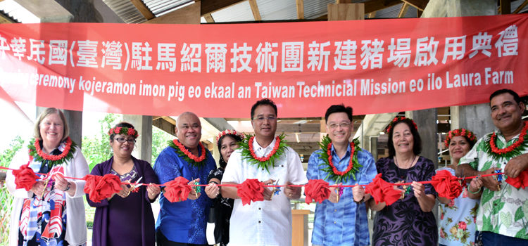 US Ambassador Karen Stewart, Barbara deBrum, Majuro Mayor Ladie Jack, Riton Jack, Minister Alfred Alfred Jr., ROC Ambassador Daniel Tang, Minister Amenta Matthew, Cathy and Senator David Kramer at the ribbon-cutting ceremony. Pig production to escalate