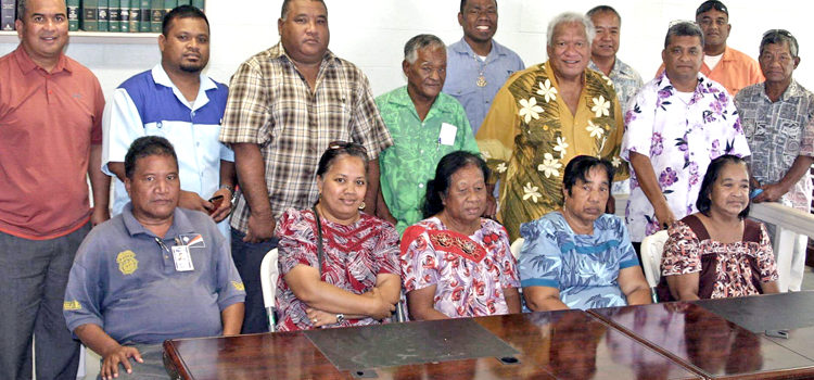 Prominent Kwajalein landowners, led by Irooj and Senator Mike Kabua (fifth from right standing), gathered on Ebeye recently to sign a history-making 70-year master lease for the Ebeye-to-Gugeegue sector of the atoll. Joining them is Kwajalein Senator David Paul, left, who said the master lease provides the security needed by donor agencies and lenders to investment in improvement projects for the atoll. Ebeye owners make history