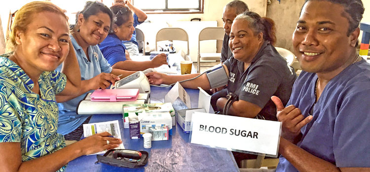 Neilani Ackley (LDS Charities), Lizabeth Jack (CMI Land Grant), Dr. Lusiana Monoa (NCD clinic), and Edward Kornelious (MOH rehab) screen MALGov police officers. CLP is on the right track
