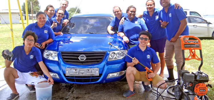 Car washers left from front: Black Chen, Connie Leon, Nicki Hsu, Sister Preston and Elder Preston. Washers right from front: Jeff Lin, Yitha John, Tanner Smith, Dr. Lusiana Manoa, Edward Konelious. Free car wash and health check