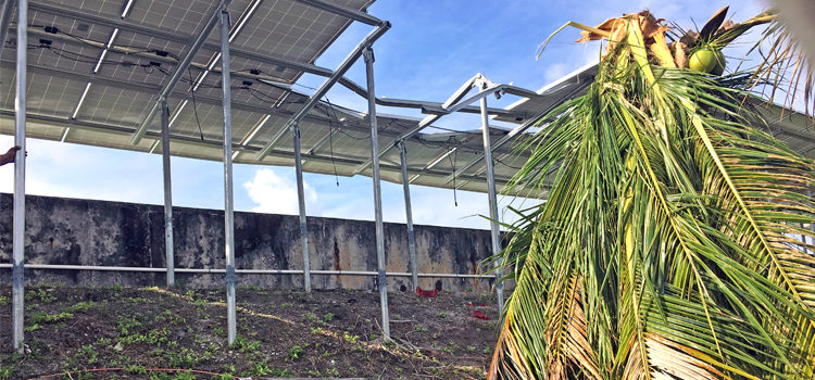 Solar panels that line the Majuro water reservoir near the airport were damaged Wednesday morning when NTA’s cell phone communications tower across the street fell down. Photo: Giff Johnson. Tower falls, sends two to hospital