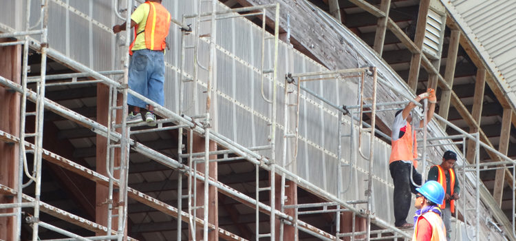 A Pacific International Inc. construction crew at work on the outside of the ECC gym in Delap earlier this week. Photo: Isaac Marty. Work starts on ECC gym