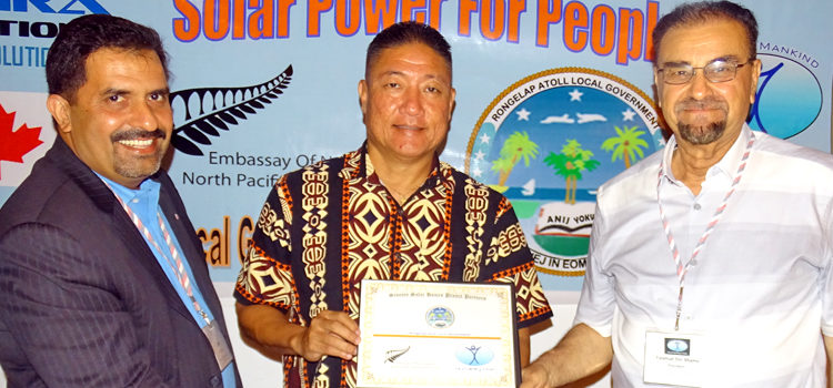 Humanity First Marshall Islands launched a new home solar program for the Rongelap community Monday at Marshall Islands Resort. From left: MRA Solutions Smart Energy Specialist Munawar Arain, Rongelap Mayor James Matayoshi and Humanity First Chair Falahud Din Shams signed off on a project agreement at the Resort during the ceremony. Photo: Hilary Hosia. 70 homes get solar