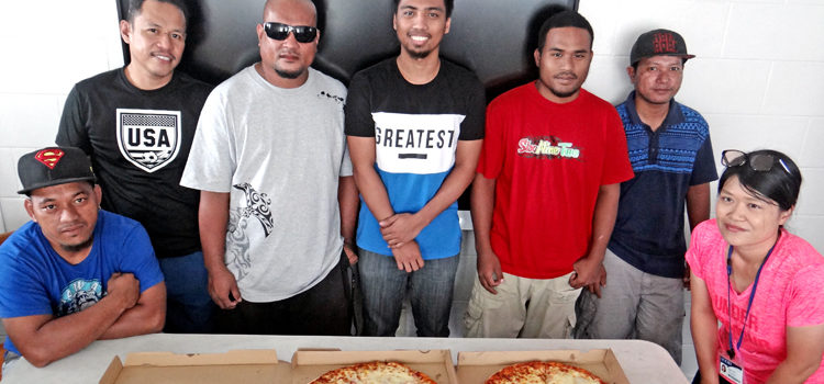 Marshall Islands Basketball Federation’s Rickiano Antibas, third from left, delivered pizzas to the College of the Marshall Islands IT to thank them for helping during the BOMI 17th Ralik Ratak Shootout Basketball Tournament. From left: Dallas Tiberke, Boni Sanchez, Rickiano Antibas, John Villafania, Bruce Kattil, Leban Joash and Wakoko Kanno. Photo: Hilary Hosia CMI ensured thousands watched Shootout
