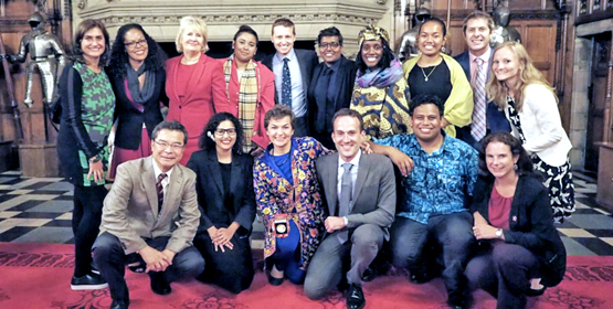 Selina Leem, standing third from right, joined a ceremony recognizing climate diplomat Christiana Figueres, kneeling third from left, at Edinburgh Castle during the Peace Boat’s Europe tour. Photo: Ashwa Faheem. Selina beats climate action drum