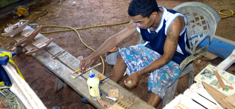 Waan Aelon in Majel (Canoes of the Marshall Islands) trainee Cory Jokray working on a series of outrigger canoe models as part of a six-month vocational and life skills training program that wraps up with a graduation September 28. Photo: Craig Vila. WAM opens doors