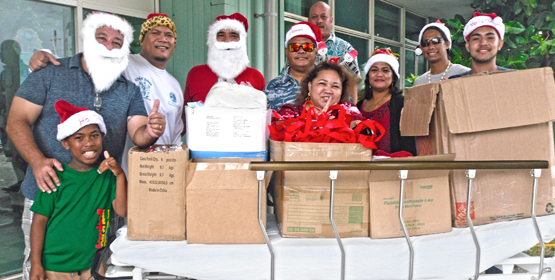Santa Claus appeared to have a twin brother during the Kramer/Muller family visit to Majuro hospital to spread holiday cheer to patients and staff. Photo: Brett Schellhase. Christmas visit
