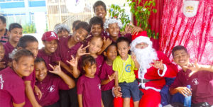 Students from Majuro’s Deaf Education Center enjoyed their moment with a Santa who dropped into the College of the Marshall Islands. Photo: Kelly Lorennij.