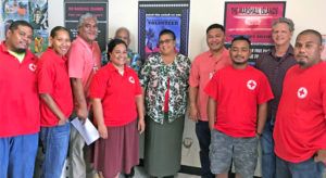 Health Minister Kalani Kaneko (fourth from right) and Health Secretary Julia Alfred (center) signed the agreement with Red Cross Secretary General Jack Niedenthal (second from right) and Red Cross President Dr. Alex Pinano (not pictured). The event was witnesses by Red Cross staff and volunteers.