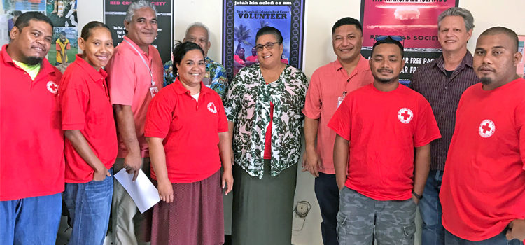 Health Minister Kalani Kaneko (fourth from right) and Health Secretary Julia Alfred (center) signed the agreement with Red Cross Secretary General Jack Niedenthal (second from right) and Red Cross President Dr. Alex Pinano (not pictured). The event was witnesses by Red Cross staff and volunteers. Ramping up first aid program