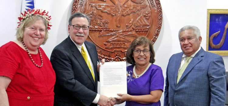 Interior Assistant Secretary Doug Domenech presents a grant award for Majuro Water and Sewer Company to President Hilda Heine Tuesday, as US Ambassador to RMI Karen Stewart and RMI Ambassador to the US Gerald Zackios look on. Photo: Hilary Hosia. Interior meets President, veterans