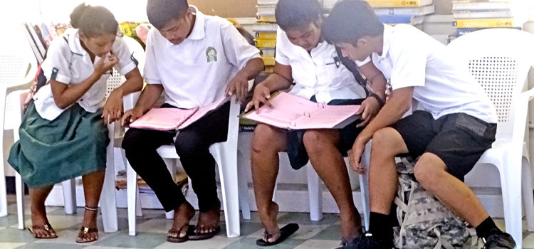 Students pour over information and lists of roles in the play Grease during an audition earlier this week at Marshall Islands High School campus. Dozens of local students will be engaged in staging the play. Photo: Kelly Lorennij. Gearing up for Grease