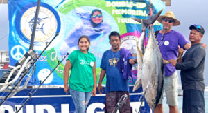 Christal deBrum was on hand to welcome back fishermen to RRE Shoreline Dock last Saturday for the MBC Miss Christa’s Memorial, including Team Jaqueline (captained by Melven Aliven, right) with their winning yellowfin tuna. Photo: Rebecca Lathrop.