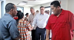 KBE Mayor Anderson Jibas (right) leads the US delegation of Interior Department Assistant Secretary Doug Domenech and Office of Insular Affairs Director Nikolao Pula into the Bikini Town Hall for a meeting last week. Photo: Hilary Hosia.