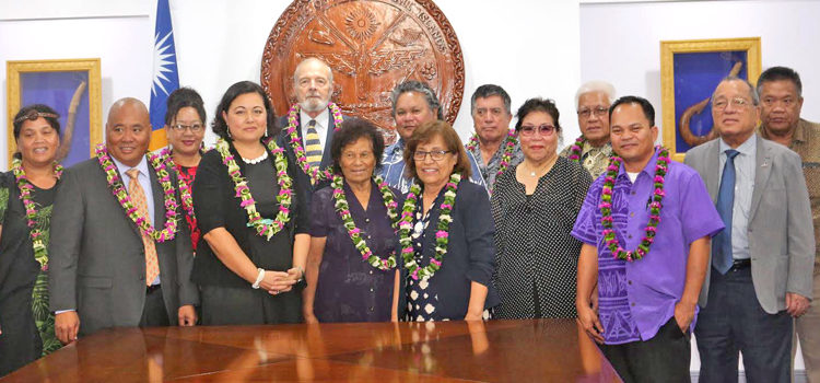 President Hilda Heine, center, joined the swearing in of the RMI National Nuclear Commission. Numerous family members and high officials attended the event that saw Chairperson Rhea Moss-Christian, and Commissioners Bill Graham and Alson Kelen take oaths of office. Photo: Office of the President. N-Commission sworn in