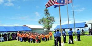 Raising flags on Ejit Island. Photo: Hilary Hosia.