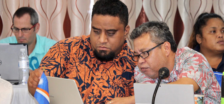 Outgoing PNA Chairman Glen Joseph (right), who directs the Marshall Islands Marine Resources Authority, consults with MIMRA Legal Advisor Laurence Edwards, II, during the PNA Officials meeting on Nauru recently. Photo: Rebecca Lathrop. PNA tuna futures are “green”