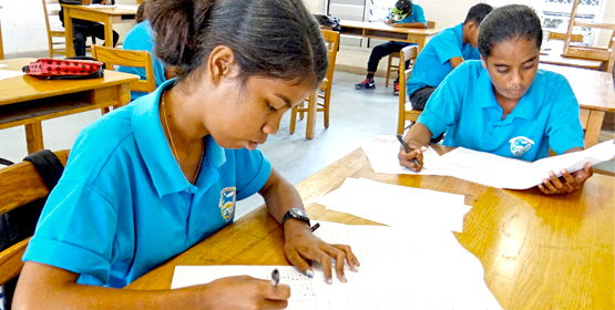 Laura High School tenth graders Dashina Mojetin (left) and Samantha Antibas take the Marshall Islands Standard Achievement Test in this file photo from 2015. Photo: Hilary Hosia. Great student-teacher ratios