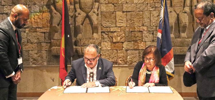 Papua New Guinea Prime Minister Peter O’Neill and RMI President Hilda Heine sign the new air services deal during the Pacific Leaders Meeting (PALM) in Japan last week. Photo: Marshall Islands President’s Office. Historic air deal signed
