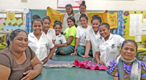 The MIHS sewing team, clockwise from left: Faleala Mae, Raine Kabinmeto, Ester Thomas, Heslina Kerong, Andrea deBrum, Kimiko Mista, Pearlina Jajo and Utoane Teniu. At back standing from left: Celista Namto and Jola Lejer. Photo: Hilary Hosia.