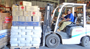 Warehouse forklift operator James Laidren maneuvers around a packed warehouse last week at the Marshall Islands Shipping Corporation warehouse at Uliga Dock. Photo: Hilary Hosia.