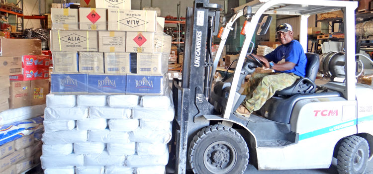 Warehouse forklift operator James Laidren maneuvers around a packed warehouse last week at the Marshall Islands Shipping Corporation warehouse at Uliga Dock. Photo: Hilary Hosia. Shipping deluged with cargo