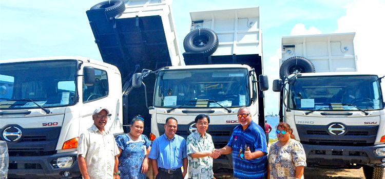 Japan Ambassador Hideyuki Mitsuoka handed over to Minister Tony Muller three dump trucks and spare parts for heavy equipment donated earlier, as other VIPs look on. Japan’s heavyweight donation