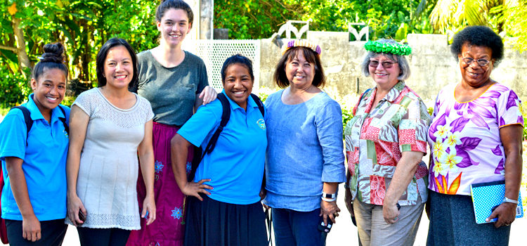 Western Association of Schools and Colleges representatives Gayle Yamaguchi and Roberta Abaday (third and second from right, respectively) visited Laura High School in May, meeting students and teachers as part of their review of the school. Photo: Public School System. Majuro schools win US approval