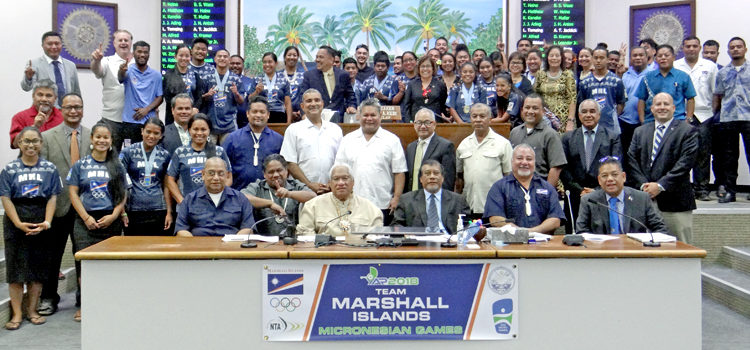 Athletes, coaches and administrators for Team RMI that competed at the Micronesian Games in Yap last month join with Nitijela members in a recognition ceremony Monday in the chamber. Photo: Hilary Hosia. RMI athletes, coaches honored