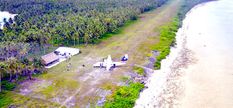 An Air Marshall Islands plane parked next to the airport terminal on Lae Atoll. Photo: Tyler Milne. AMI ramps up outer island flights
