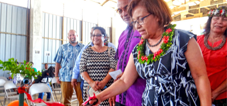 President Hilda Heine cuts the ribbon to the new can and bottle recycling equipment at Majuro Atoll Waste Company’s recycling center as MAWC Manager Jorelik Tibon and other VIPs look on. Photo: Hilary Hosia. MAWC launches recycling operation