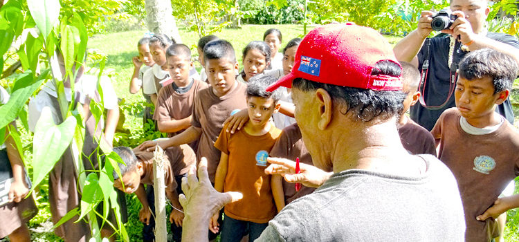 Laura resident Jabukja Aikne talked to Woja Elementary students last week about the “what, how and why” of successful farming in Majuro. Photo: Kelly Lorennij. Fruits of their labor