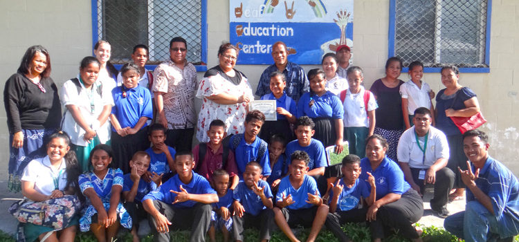 MIEPI board members Hirobo Obeketang, Yolanda Lodge-Ned and Arlington Tibon hand over a $1,000 grant to the Majuro Deaf Education Center for a special project to develop awareness around mental health issues. Photo: Hilary Hosia. MIEPI celebrates by funding ideas