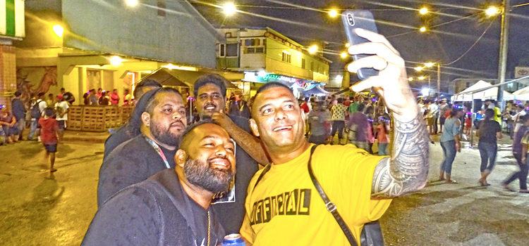 Do It Best Manager Larry Hernandez, Jr. (foreground) was in a festive mood at the Block Party, shooting selfies with friendly party-goers New Year’s Eve in Uliga. Photo: Hilary Hosia. Majuro’s Block Party blast