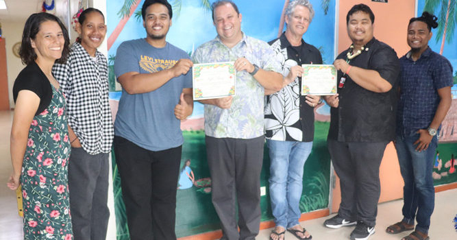 Staff from Wellness Center and the RMI Red Cross Society are all smiles as they show off copies of their recently signed MOU. Photo: Kelly Lorennij. Red Cross, Wellness team up