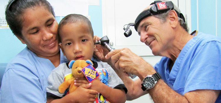 Canvasback team works with a young patient at Majuro Hospital. Palau, FSM to Get Great RMI Service