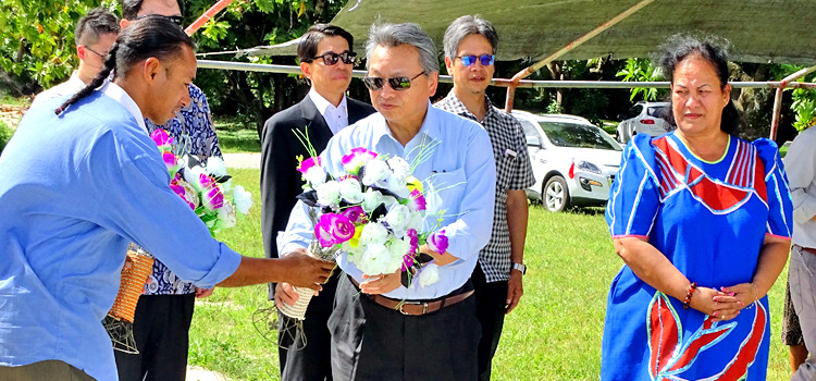 ROC Vice Minister for Foreign Affairs Bruce Linghu prepares to lay flowers at the grave site of the late President/Iroijlaplap Jurelang Zedkaia in Ajeltake, as Zedkaia’s widow Hannah looks on. Photo: Hilary Hosia. Bruce honors late Jurelang