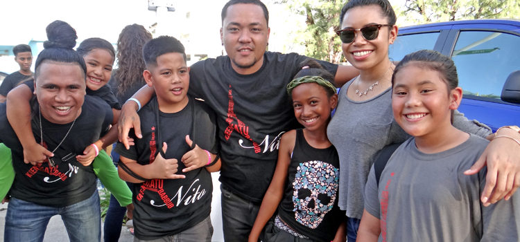 Kendall Titiml (left), with Kevin Kedi (middle) and Elei Titiml (right) with kids during a walkathon that led into a concert for the Nito Butterfly Foundation in Majuro recently. Photo: Hilary Hosia. Kendall headlines Nito benefit
