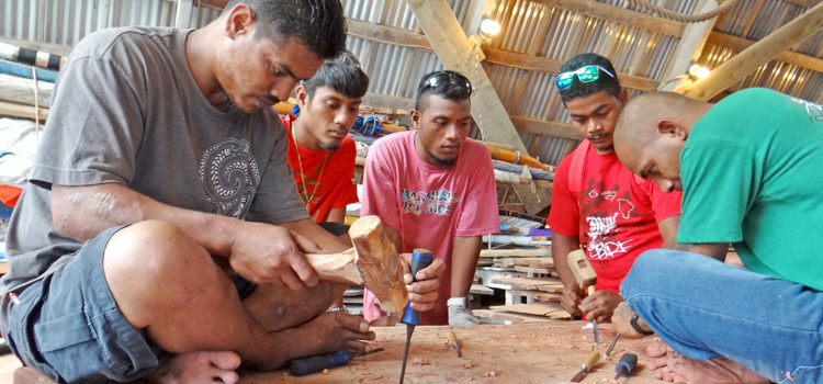 WAM trainees Abija Lometo, Johnson Anwel, Ralles Anwel, Sealend Laiden, and Maston John (bottom) create the RMI seal for the RMI Cabinet in the canoe program’s workshop. Photo: Hilary Hosia. WAM develop youth skills